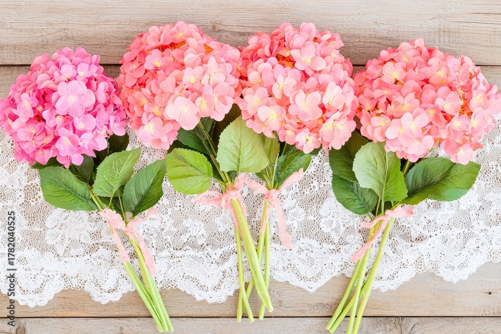 Obraz premium Pink Hydrangeas on Lace Cloth on Antique Table - Floral Arrangement Photography