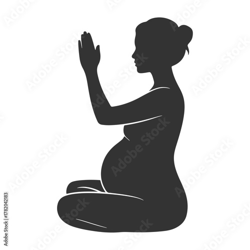 Pregnant Woman Meditating in Silhouette