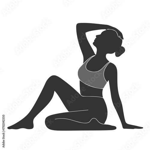 A graceful silhouette of a female figure performing yoga