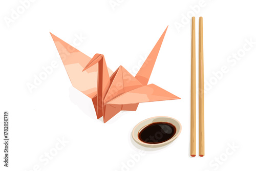 Delicate pink origami crane placed beside bamboo chopsticks and a small dipping sauce dish