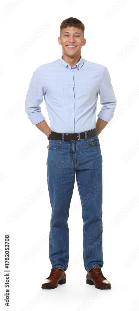 Naklejka premium Handsome young man in stylish jeans on white background