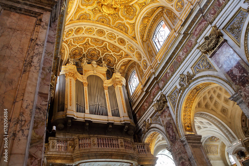  Pipe organ in the Church of St. Louis of the French (San Luigi dei Francesi), Rome. Gilded baroque architecture and marble details.