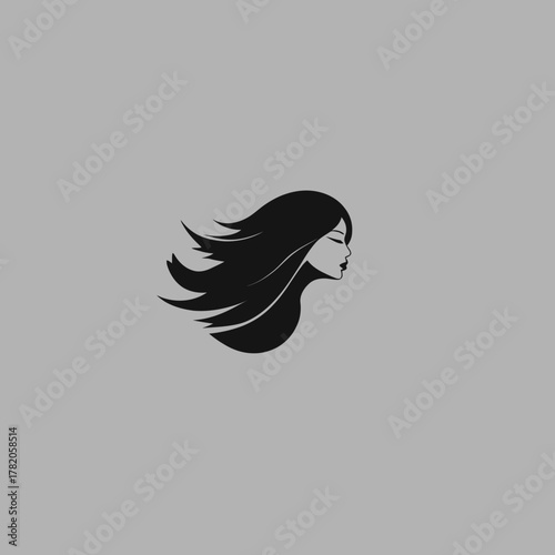Abstract silhouette profile of a beautiful woman with long flowing hair in motion against a grey background, illustrating elegance and style.