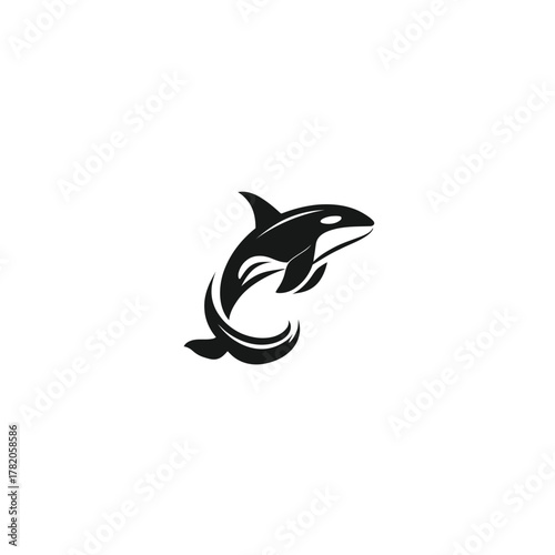 Dynamic black and white stylized orca jumping from water, killer whale graphic design element or marine mammal icon