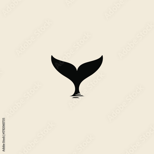 Creative minimalist logo concept featuring a black silhouette of a whale tail merging with a wine glass, on a light background.