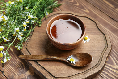 Board with bowl of honey an...