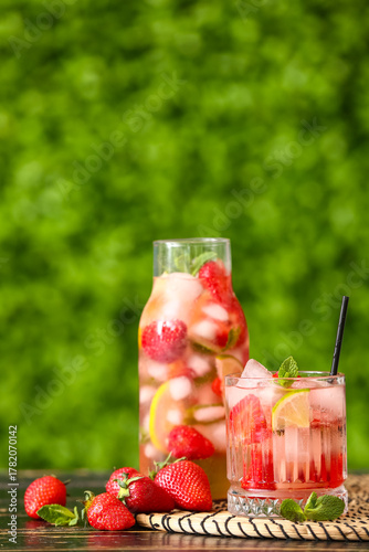 Glass and bottle of strawbe...