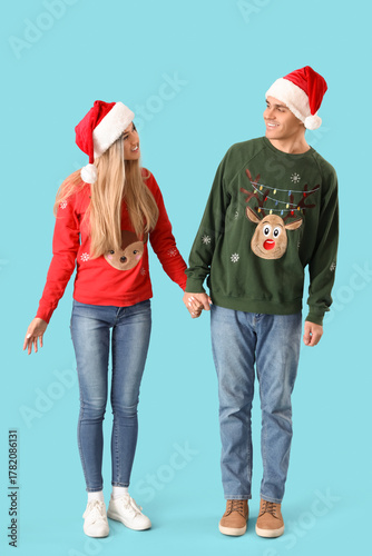 Happy young couple in festi...