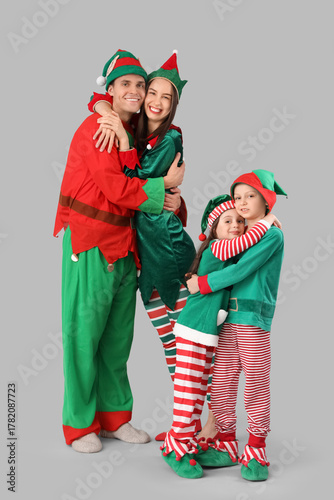 Happy family in elf's costu...