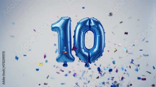Blue balloon number 10 for birthday or anniversary party. White background with falling confetti
