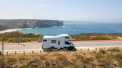 Motorhome parked on scenic coastal road in aljezur, portugal