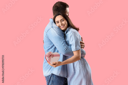 Happy young woman with gift...