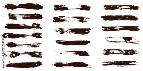 Collection of dark brown paint brush strokes on a clean white background abstract art