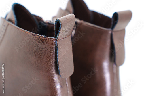 Stylish brown leather ankle boots with unique design