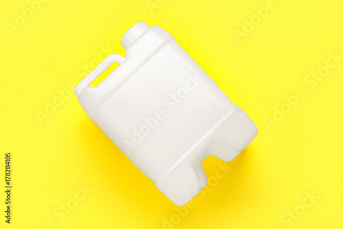 White plastic canister on y...