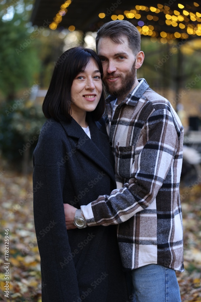 Fototapeta premium Happy couple hugging in autumn park. Romantic relationship