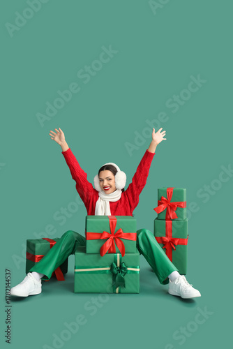 Happy young woman in earmuf...