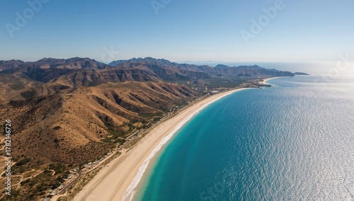 Fototapeta Naklejka Na Ścianę i Meble -  Aerial view of Karaburun Peninsula's coastline, showcasing the interplay of water and sky, with potential for seasonal exploration