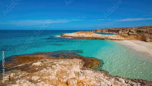 Fototapeta Naklejka Na Ścianę i Meble -  Clear azure sea water landscape with rocky coast, erosion risk