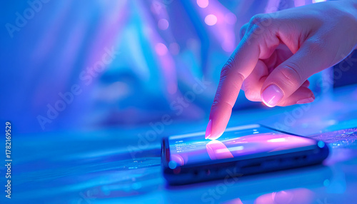 Female hand touching smartphone screen with futuristic interface