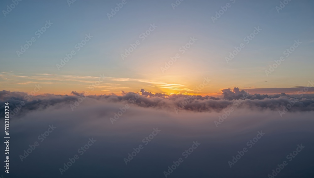 Obraz premium A glimpse of clouds against a bright blue sky, showcasing seasonal change