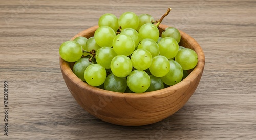 Fresh Green Grapes in Wooden Bowl on Wooden Surface.