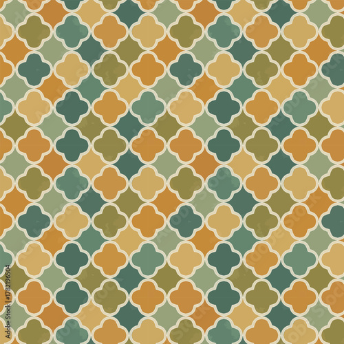 Seamless Quatrefoil Trellis Pattern. Distressed Moroccan Tile Design with Muted Earthy Tones: Teal, Olive Green, and Rust Orange. Rustic Vintage Background for Fabric or Wallpaper.
