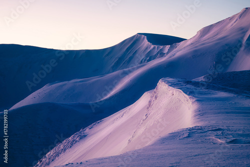 magical sunrise on a mountain peak. snowy Mountain peaks. fairytale calming landscape
