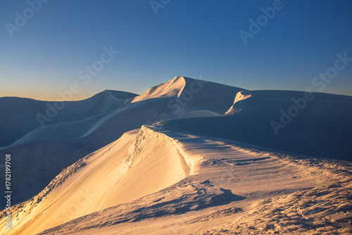 magical sunrise on a mountain peak. snowy Mountain peaks. fairytale calming landscape