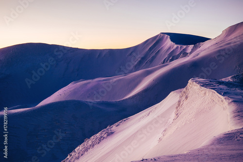 magical sunrise on a mountain peak. snowy Mountain peaks. fairytale calming landscape