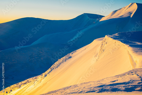 magical sunrise on a mountain peak. snowy Mountain peaks. fairytale calming landscape