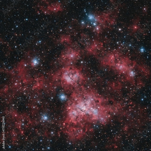 Realistic red hydrogen nebula with bright stars in deep space