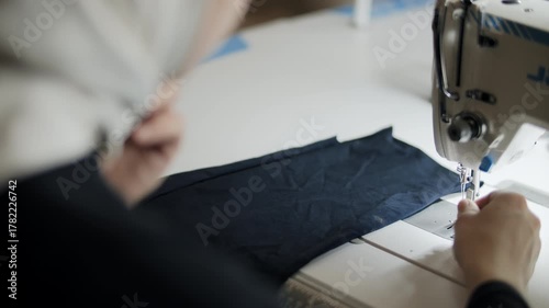 Threading needle on industrial sewing machine