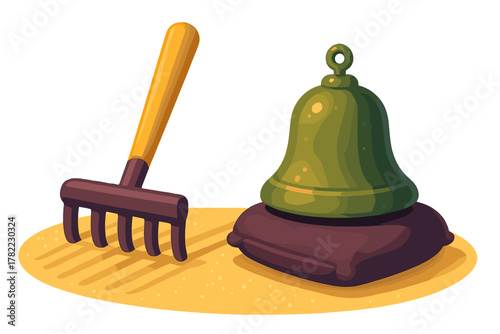 Miniature Zen garden rake and green bell resting on cushion on yellow sand