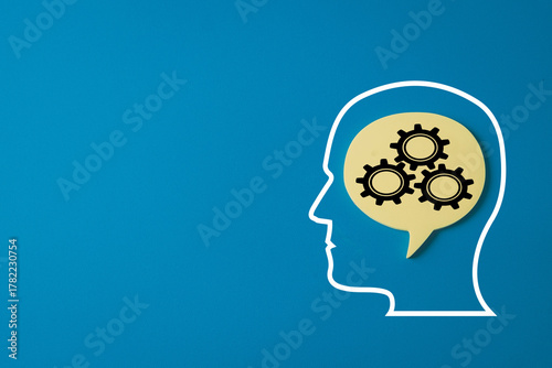 Wallpaper Mural Human head outline with gears in a thought bubble.,Concept for business strategy,mental process, innovation,artificial intelligence, problem-solving,brainstorming. Blue background with copy space. Torontodigital.ca