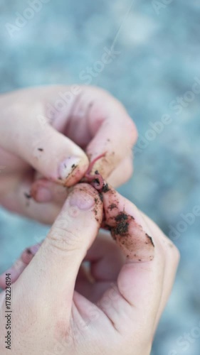 Fisherman Threading Bait on Hook – Slow Motion Close-Up, Vertical Video 