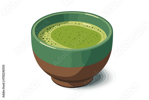 Hot frothy matcha green tea beverage served in a textured ceramic bowl
