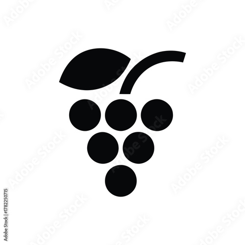 A black grapes with a leaf