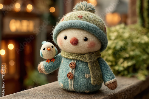 Friendly snowman with bird ...
