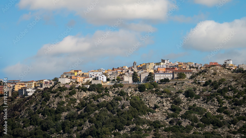 Fototapeta premium Panoramic view of Orune village in Sardinia on rocky hills under blue sky