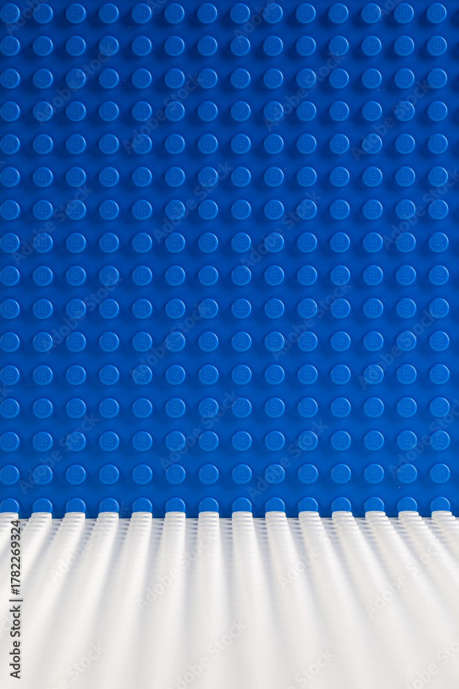 Naklejka premium Blue and White LEGO Baseplates Building Background