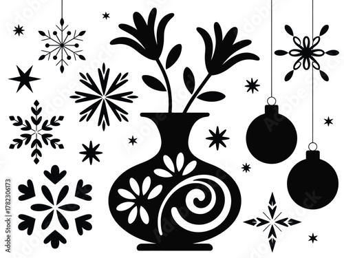 A vase with flowers is surrounded by snowflakes and festive ornaments.