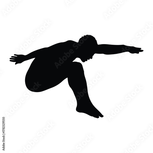 Silhouette of a diver in mid-air diving human