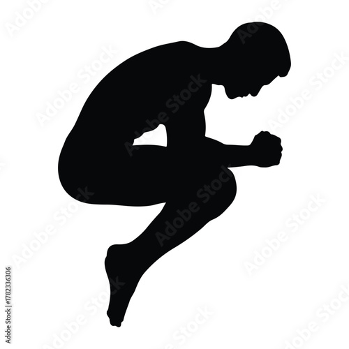 Silhouette of a man in a crouching pose with hands clasped