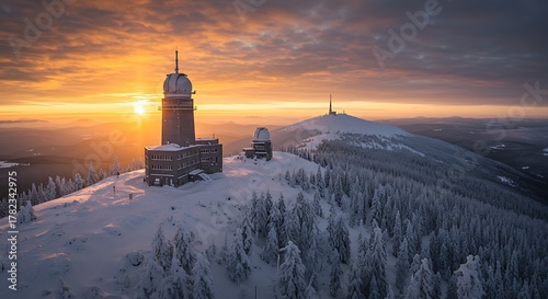 Fototapeta Naklejka Na Ścianę i Meble -  Winter Sunset over Schneekoppe Mountain with Observatory and Snow-Covered Trees.