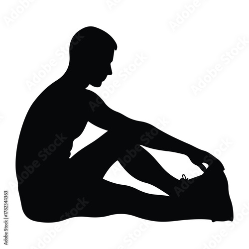 Silhouette of a man stretching his leg exercise fitness
