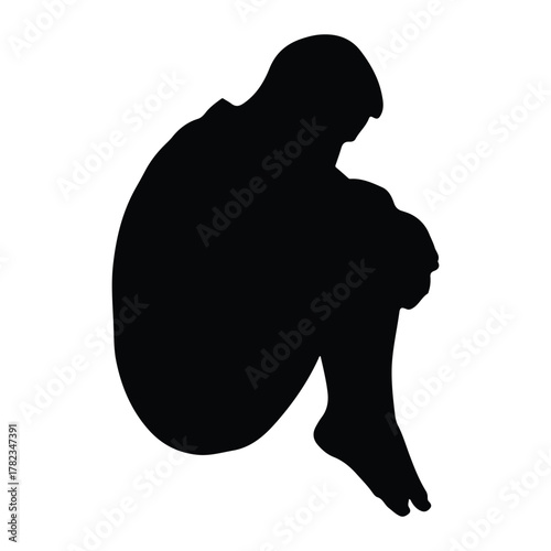 Silhouette of a person curled up in a fetal position