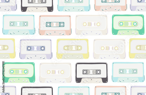 Seamless pattern, background, backdrop, wallpaper with multicolored audio cassette tapes, cartoon cute colorful bright flat design. Analog media for recording and listening to music.