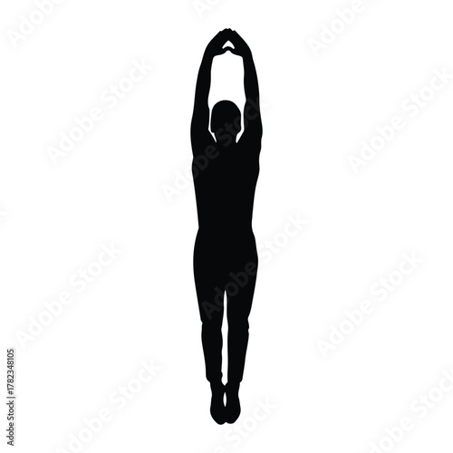 Silhouette of a person diving or jumping with arms raised