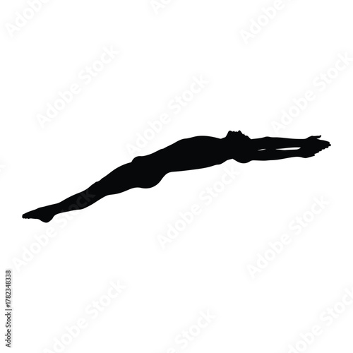 Silhouette of a person in a dramatic diving pose with arms raised